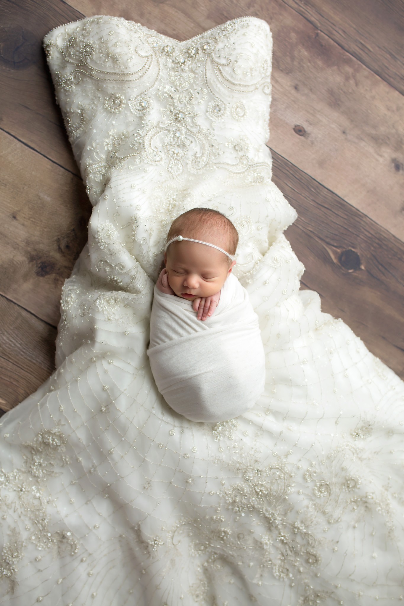 baby girl on wedding dress texas newborn photographer
