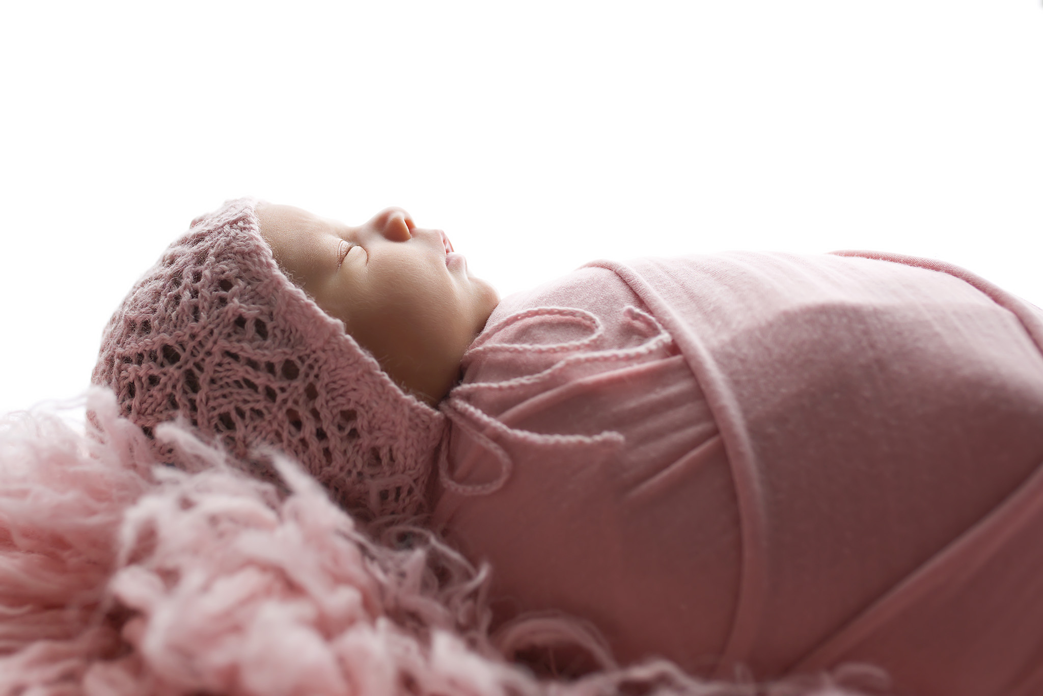 baby girl in pink texas newborn photographer