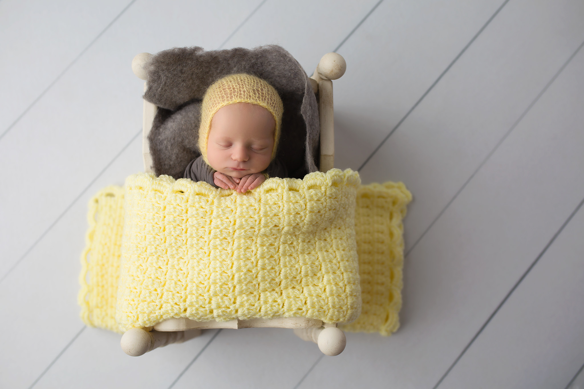 newborn in yellow dallas newborn photographer