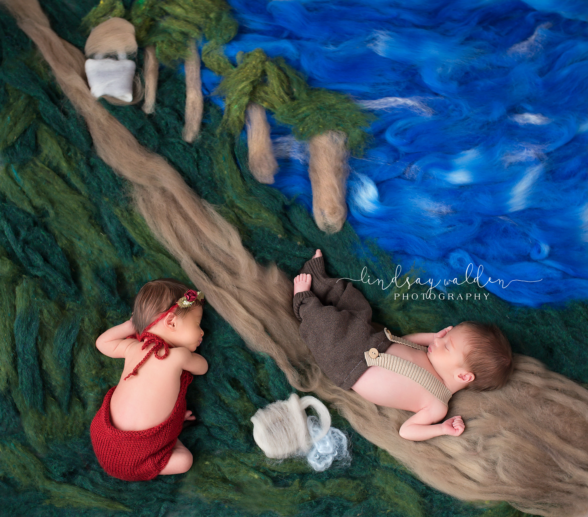 Artistic newborn baby depicting Jack and Jill nursery theme with hand felted artistic backdrop.