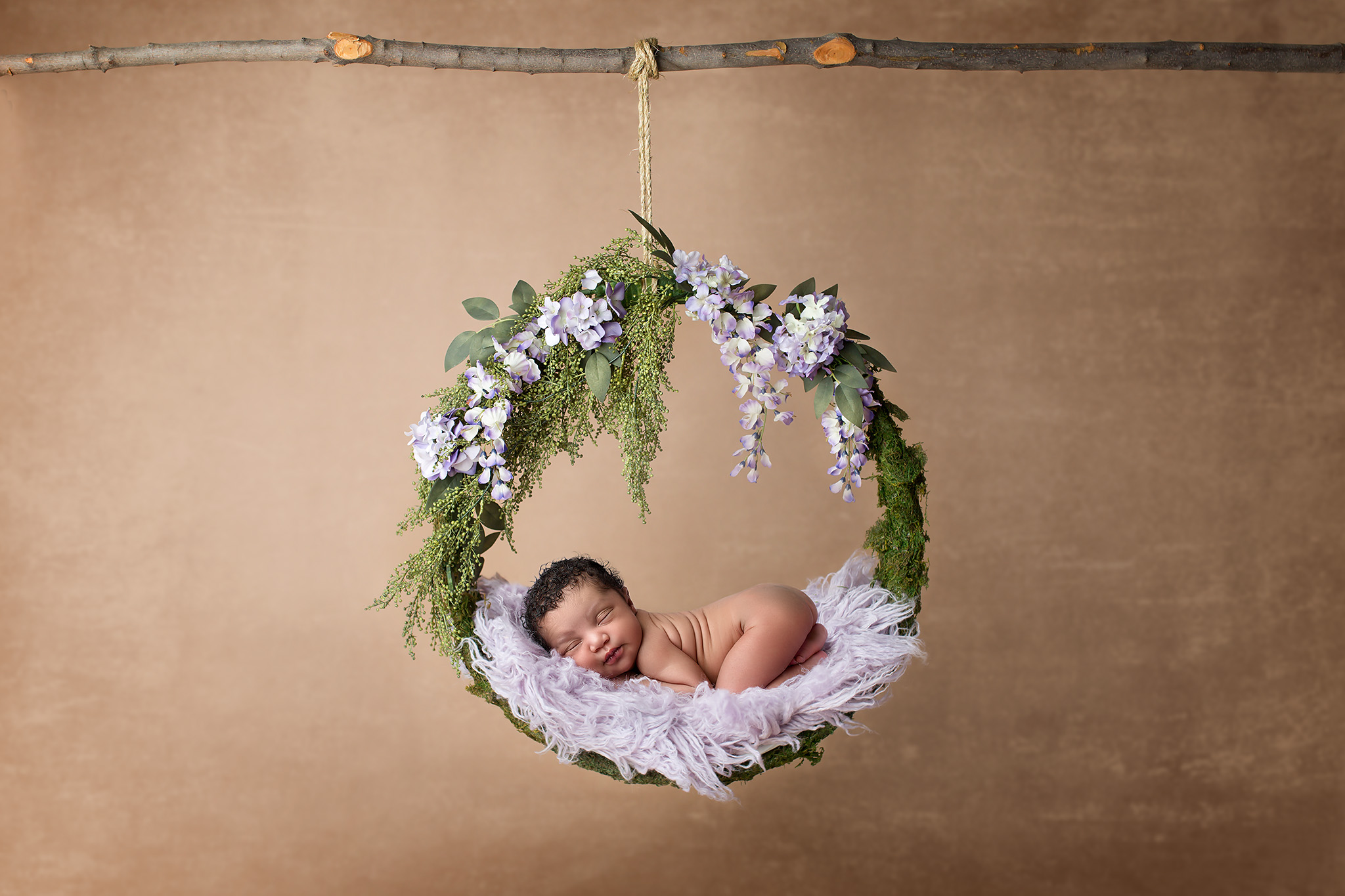 newborn girl in wreath
