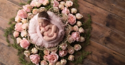 newborn in flower wreath