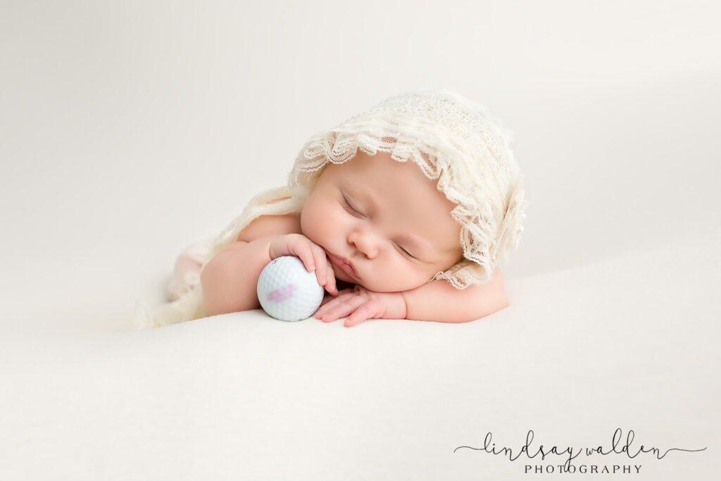 newborn portrait with golf theme