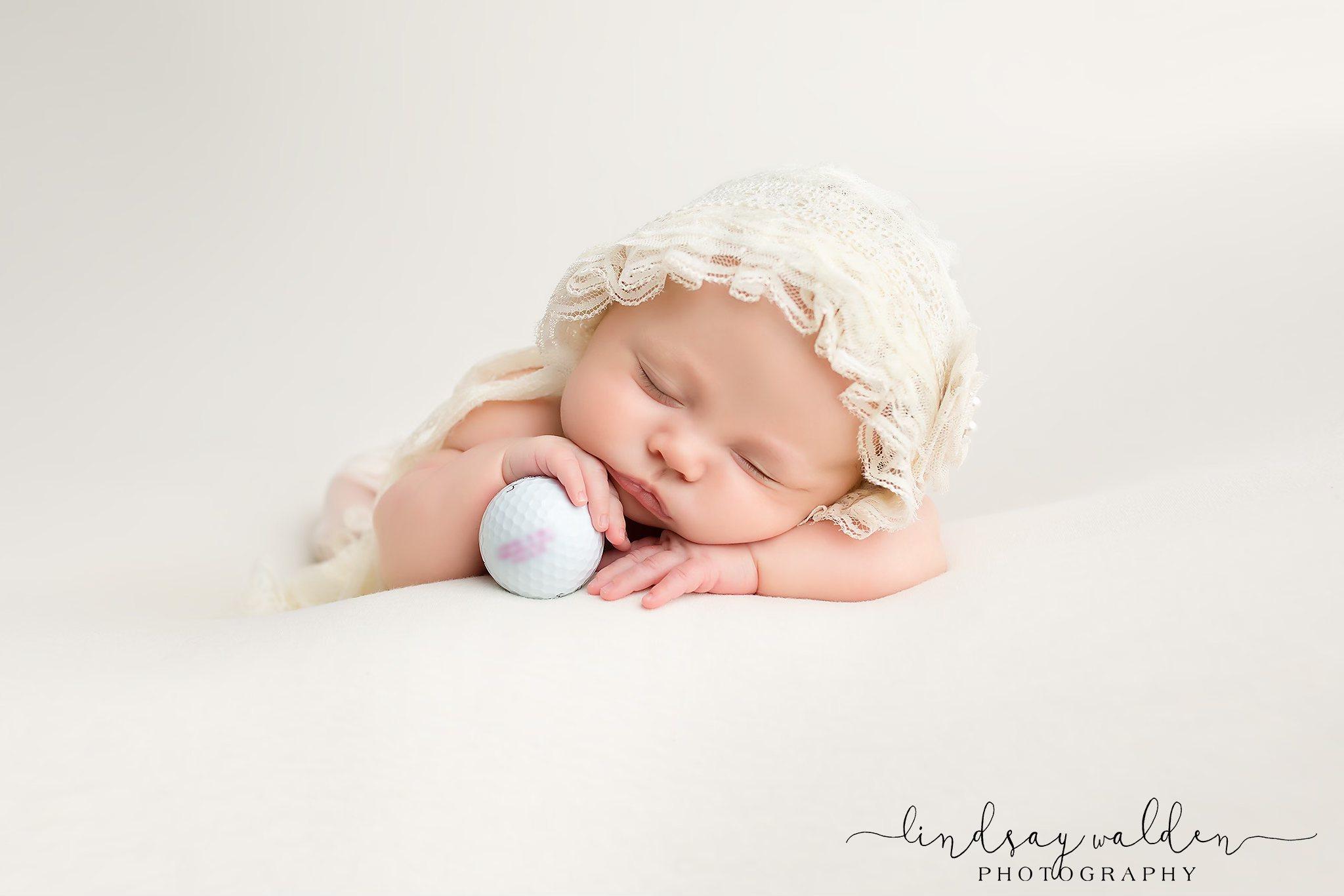 newborn portrait with golf theme