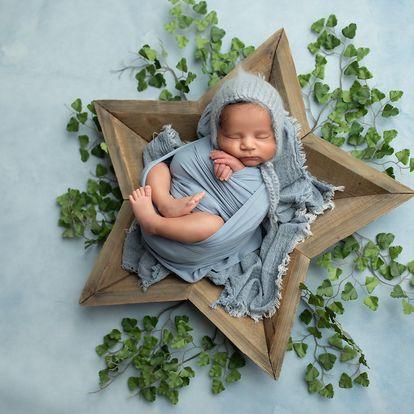 newborn portrait in wooden star
