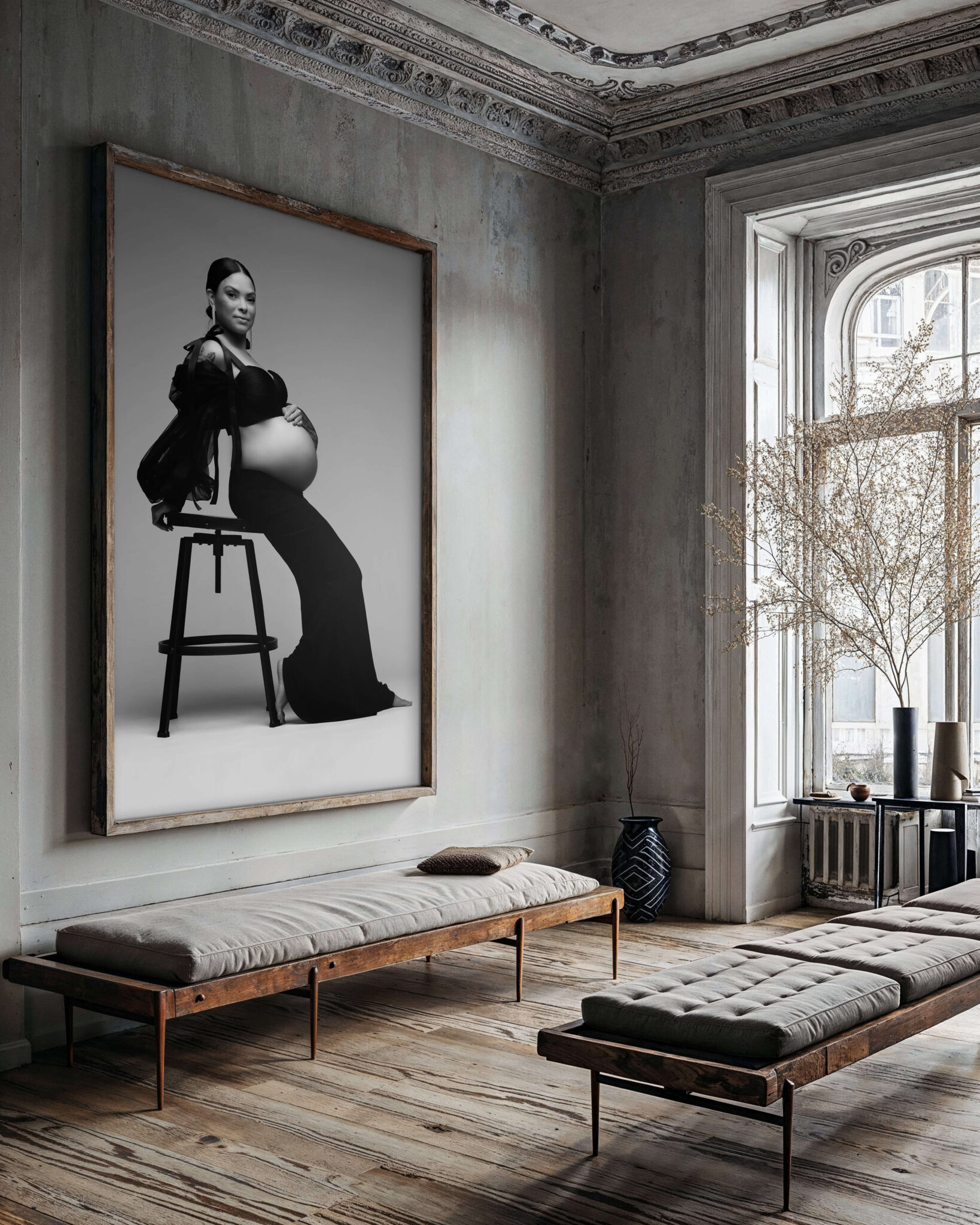 A framed fine art maternity portrait hangs on the wall of a modern rustic room after she got a 3d ultrasound in fort worth