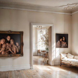 A look at a living room with large fine art images framed on the wall of a family with a newborn after visiting pediatric dentists in dallas