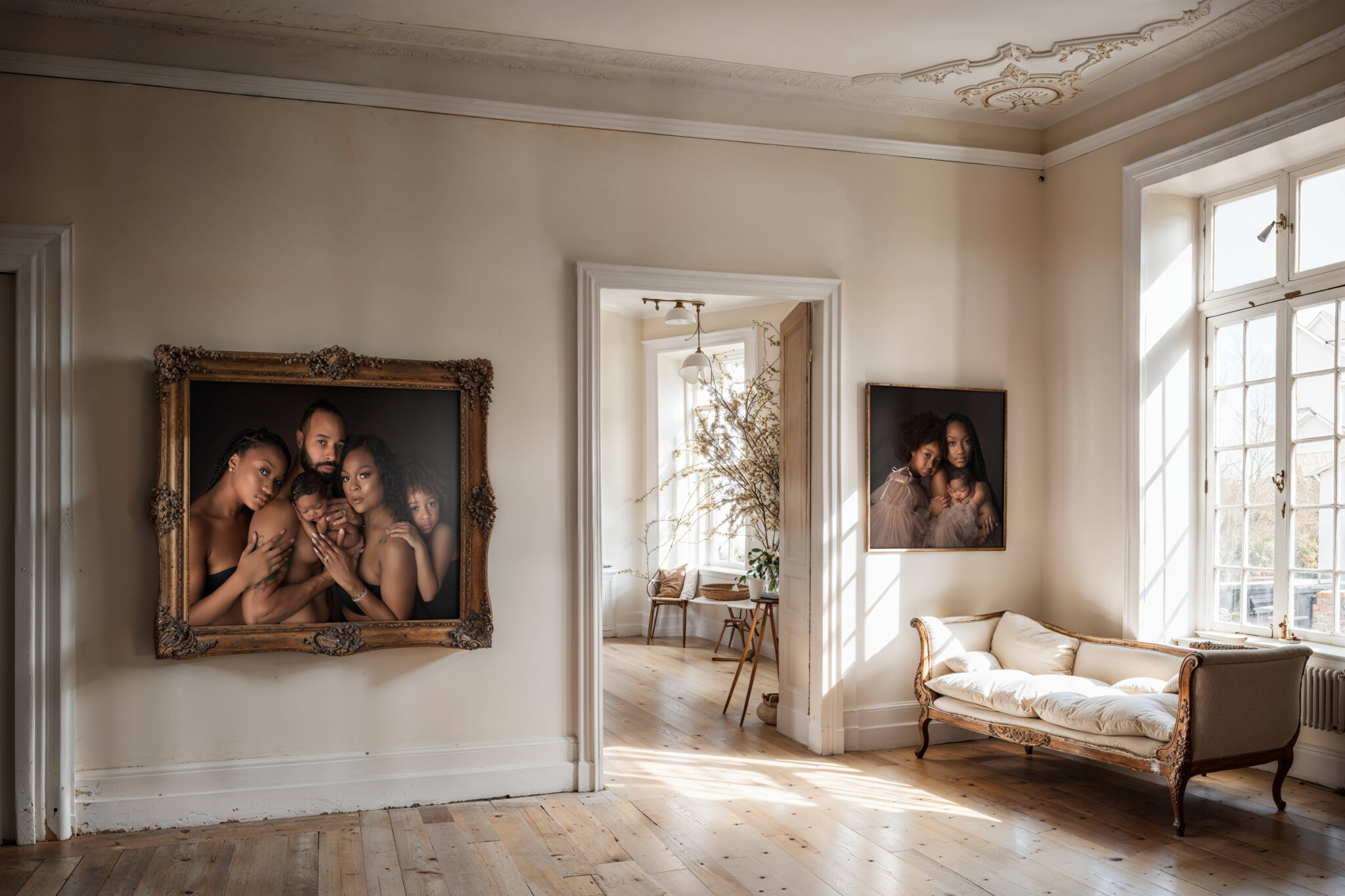 Open room with two family images on the wall next to the door. Representing Nursery Ideas for Dallas Parents.