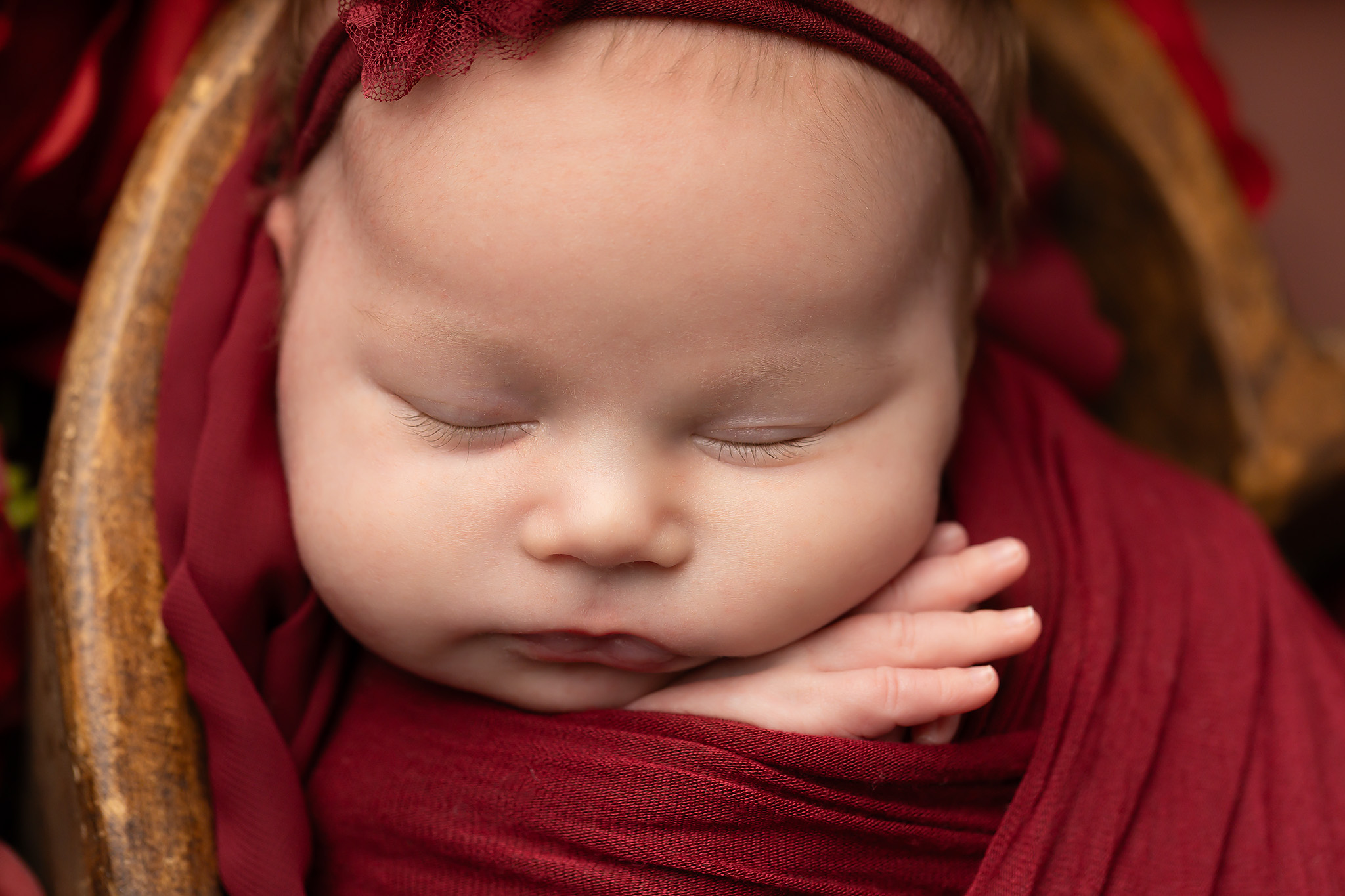 Macro image of a sleeping baby's face.